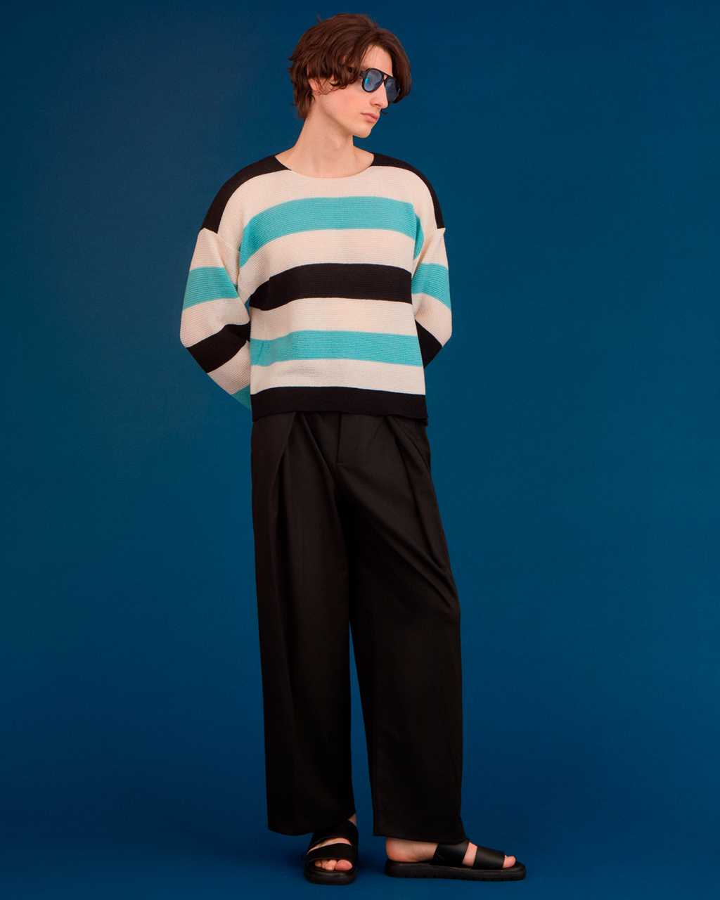 Men wearing a INGMARSON embroidered striped top