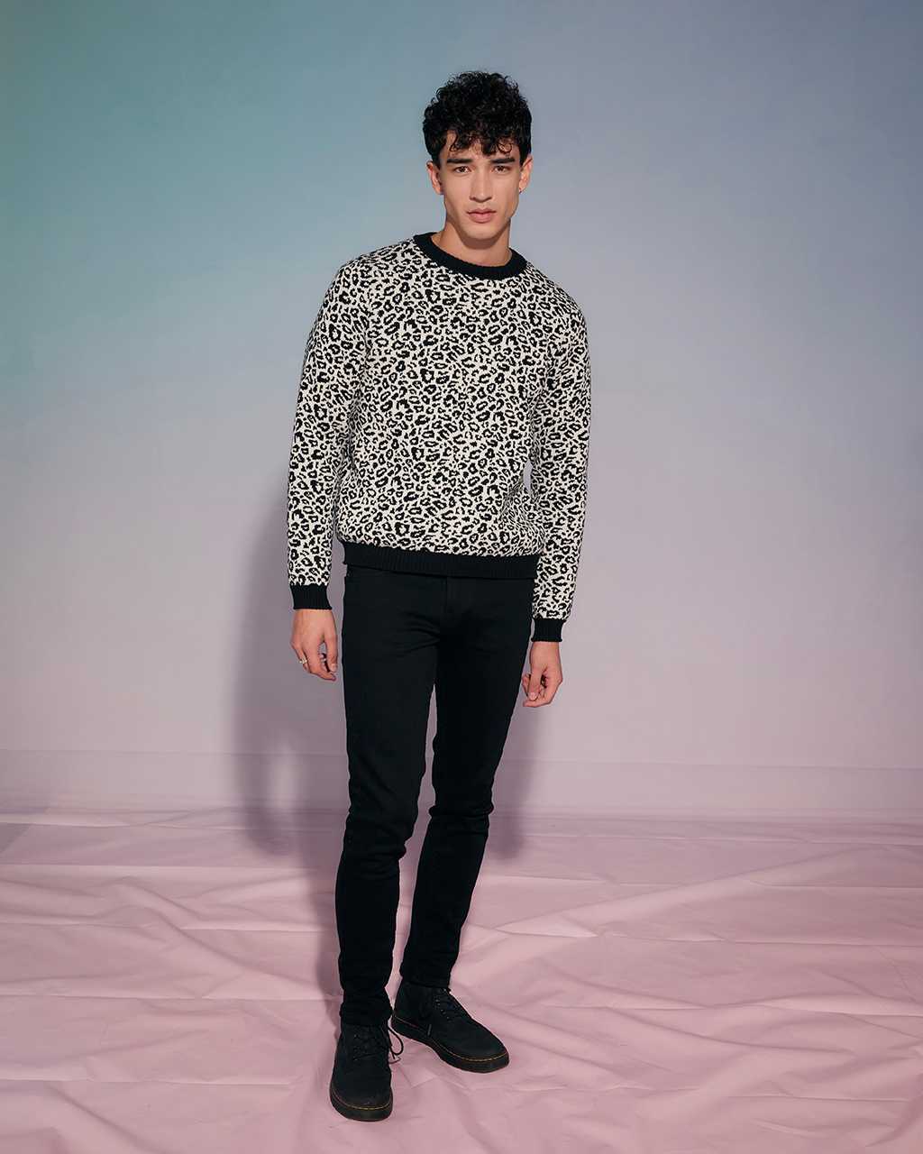 Men wearing a black and white knitted jumper 